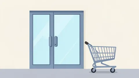 A retail store entrance with a glass door and a shopping cart parked outside