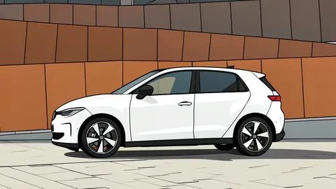 A modern electric hatchback car parked in a factory assembly bay