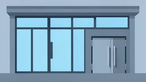 A modern bank branch facade with glass doors and a secure vault entrance