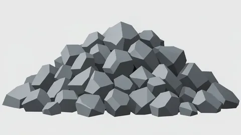 A stockpile of grey crushed stone and rock fragments in an open-air quarry