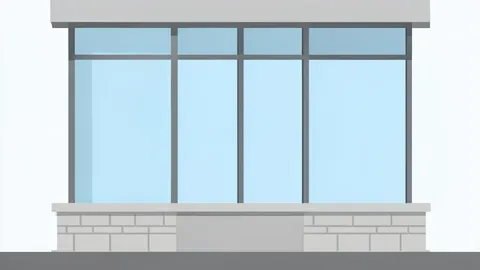 A modern bank building facade with large glass windows and a stone base