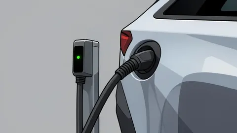 A modern electric vehicle charging station with a cable plugged into a car