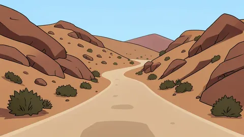A dusty, unpaved road winding through arid, rocky hills with sparse vegetation