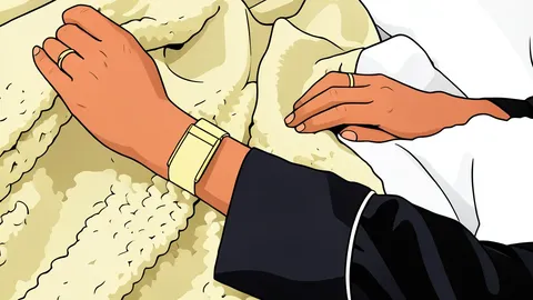 A close-up view of a flexible fabric wristband with a small, rounded sensor module attached to the center.
