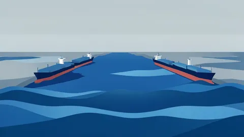 A wide, deep water strait with large oil tankers navigating through it