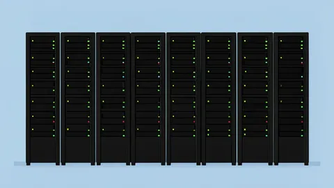 A large, modern server room with rows of black computer racks and blinking status lights
