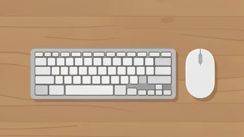 A high-angle view of a wooden desk featuring a mechanical keyboard and a computer mouse.