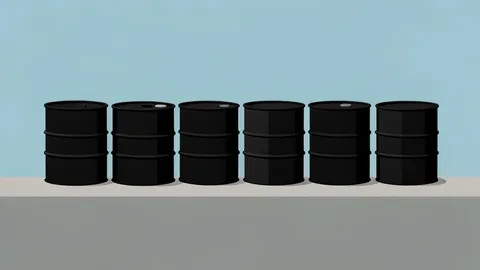 A row of black oil barrels on a concrete dock