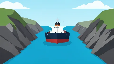 A large oil tanker ship navigating through a narrow strait between rocky coastlines
