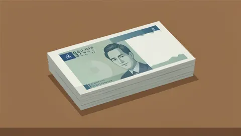 A stack of Indian Rupee banknotes resting on a wooden desk