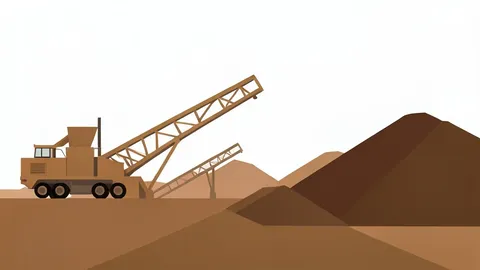 A large industrial mining site with heavy processing machinery and piles of raw ore
