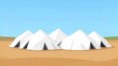 A cluster of white tents in a dusty, open field under a clear sky