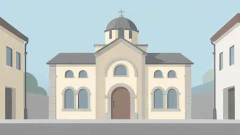 A stone synagogue building with arched windows and a dome standing on a quiet urban street.