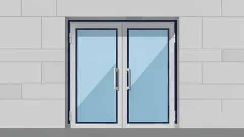 A modern bank branch entrance with glass doors and a stone facade