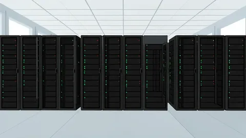 Rows of black server racks with blinking status lights inside a large, air-conditioned facility