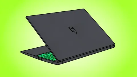 A sleek, dark-colored gaming laptop with a thin bezel and a visible keyboard, resting on a wooden desk.