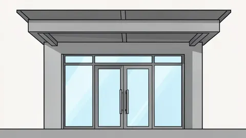 A modern bank branch facade with glass doors and a metal canopy