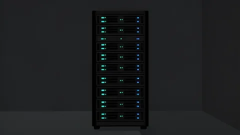 A dense rack of black server units with glowing status lights in a dark room