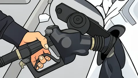 A fuel pump nozzle resting in its holster at a service station