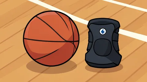 A basketball resting on a hardwood court floor next to a knee brace