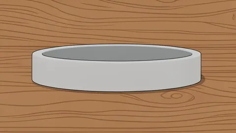 A minimalist, screen-free wristband resting on a wooden surface