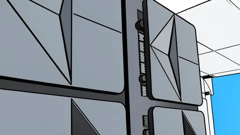 A large black mainframe computer cabinet with vertical slats in a server room.