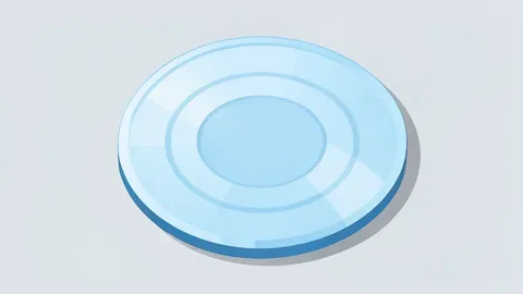 A polished silicon wafer resting on a cleanroom surface