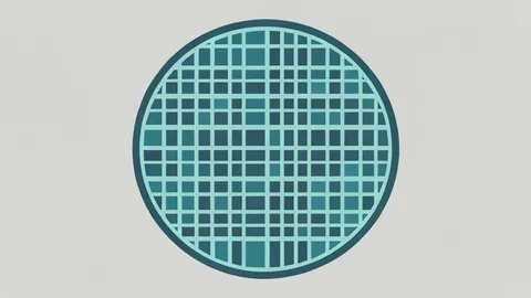 A silicon wafer featuring a precise grid of integrated circuits