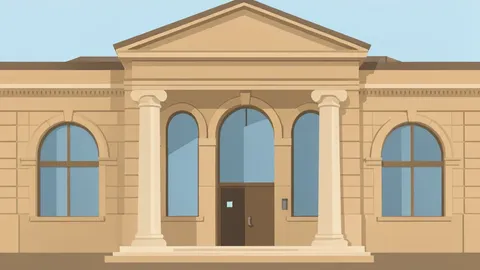 The exterior facade of a modern central bank building with large stone columns and a flagpole