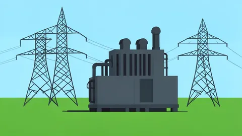 A large industrial transformer standing in a field next to high-voltage transmission lines