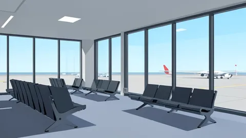 A modern airport terminal interior featuring rows of empty seating and large windows overlooking the tarmac.