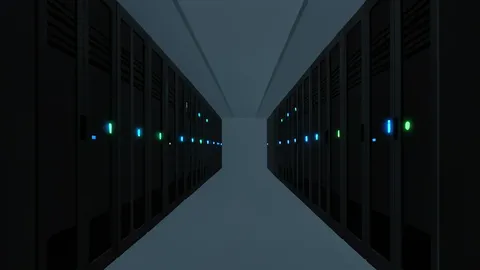 Rows of black server racks with blinking status lights in a dimly lit data center aisle