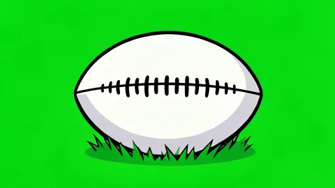 A rugby ball resting on green grass