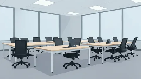 A row of empty office desks with ergonomic chairs in a large open-plan workspace