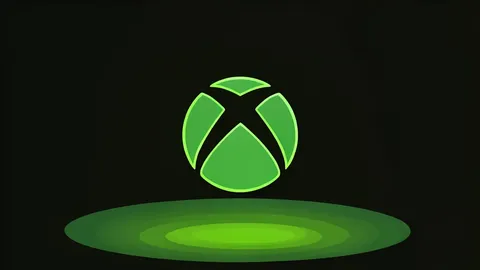 A flat vector illustration of a game controller on a desk next to a closed laptop.