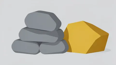 A pile of grey metallic ingots and a block of yellowish-brown ore