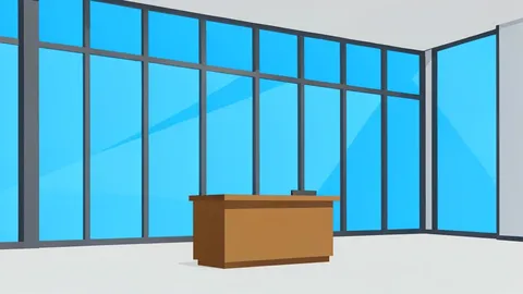 A modern office building with a glass facade and a reception desk