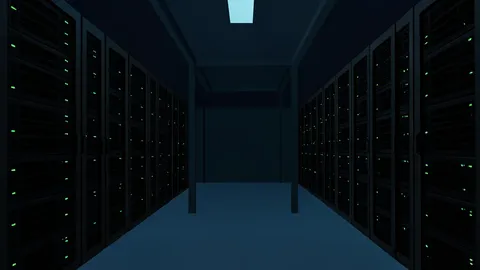 Rows of black server racks with blinking status lights in a dimly lit data center aisle