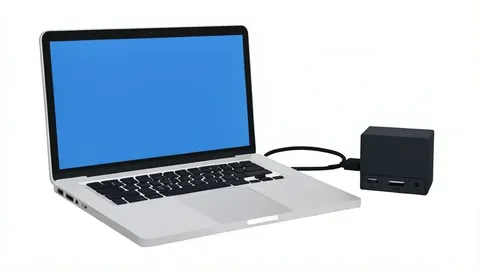 A laptop computer connected to a small external hard drive