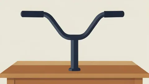 A pair of bicycle handlebars with brake levers and a stem, resting on a wooden workbench.