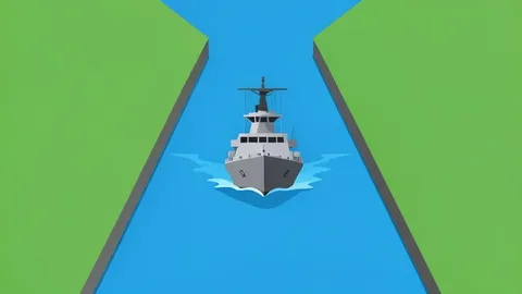 A naval warship navigating a narrow strait between two landmasses