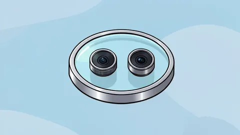 A flat, circular aluminum and glass disc with two camera lenses, designed to be worn as a pendant.