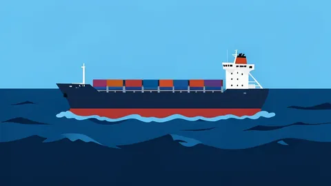A cargo ship navigating through choppy dark blue waters