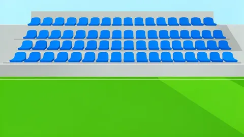 A row of empty plastic seats in a stadium stand overlooking a green grass pitch