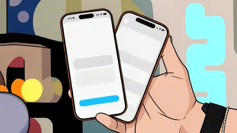 Two smartphones standing side by side on a wooden desk
