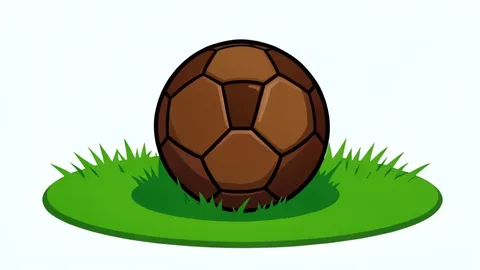 A worn leather soccer ball resting on green grass