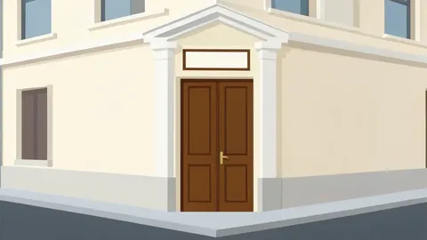 A classical European-style building facade with a closed wooden door and a small plaque above the entrance, situated on a quiet street corner.