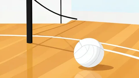 A white volleyball resting on a wooden gymnasium floor near a net post