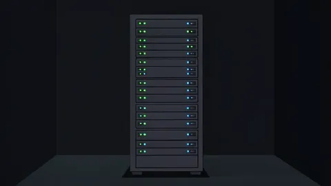 A server rack with blinking status lights in a dark room