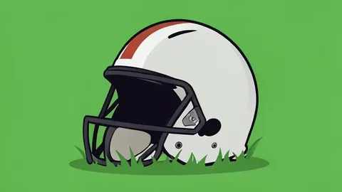 A football helmet resting on green grass
